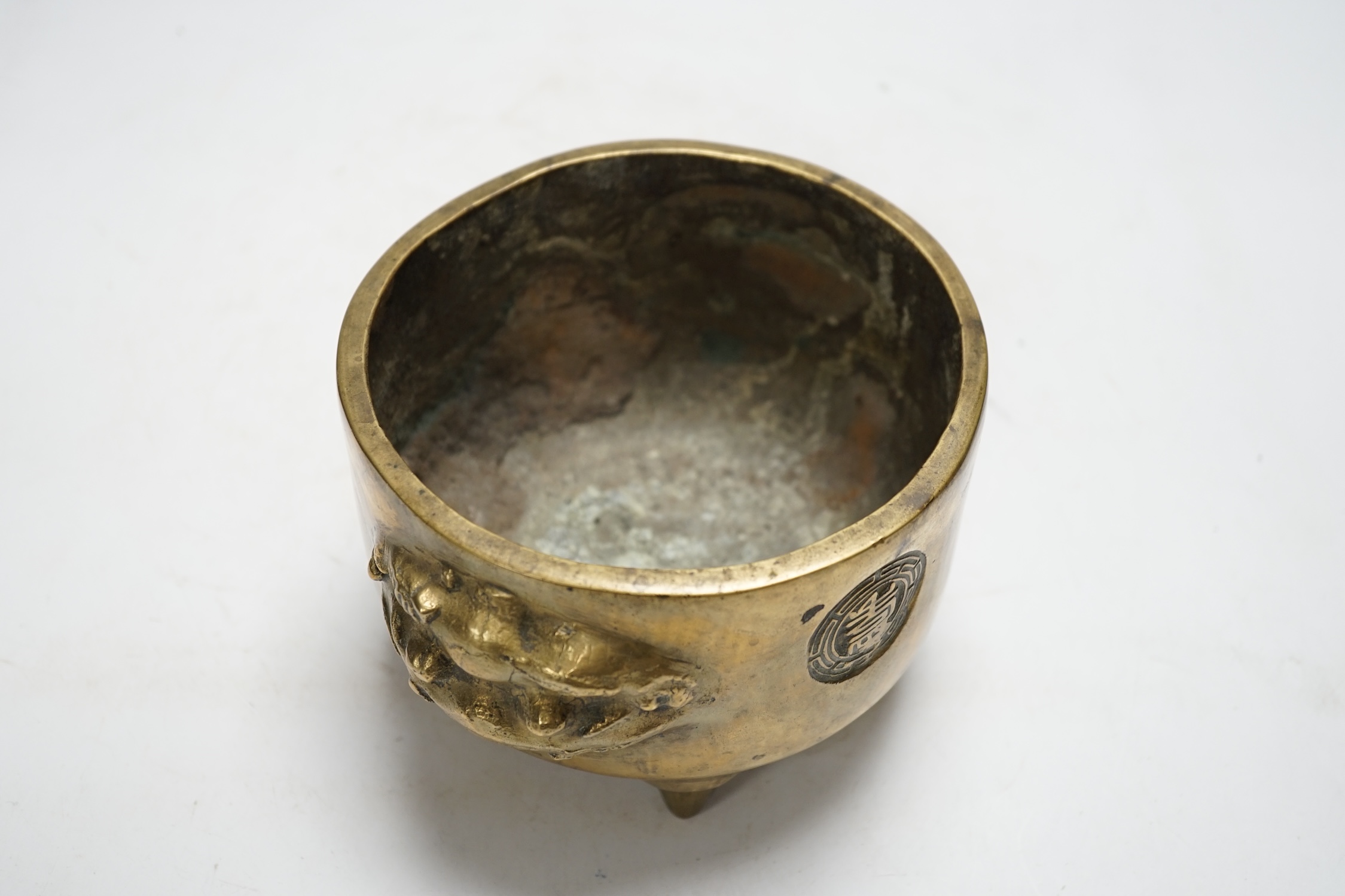 A Chinese bronze tripod censer, 18cm. Condition - fair to good